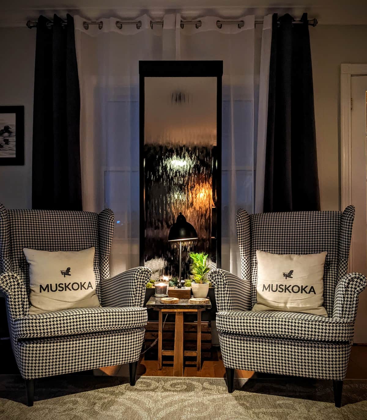 Houndstooth wingback chairs with Muskoka pillows in the common area